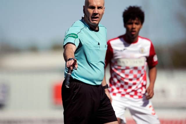 Stephen Finnie took control of his final league game as a referee. Picture Michael Gillen.
