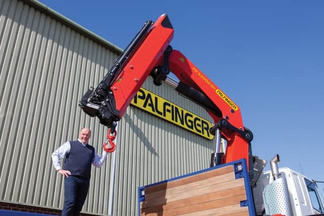 TH White director Mark Rigby with one of the Palfinger UK lorry cranes