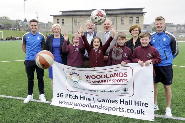 The formal handover of Woodlands Games Hall and pitch as a community asset.