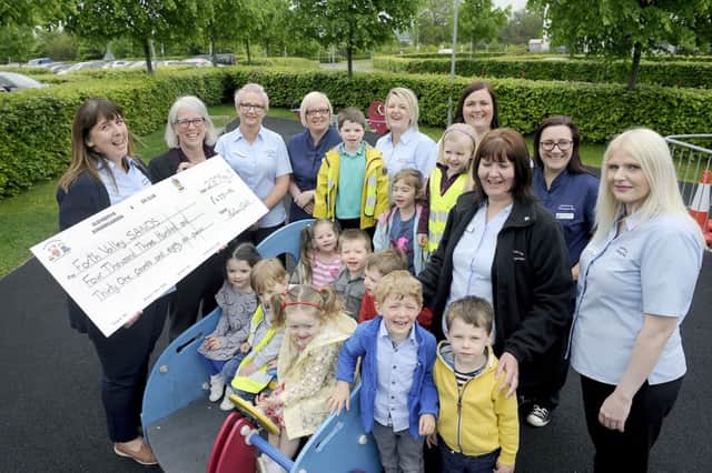 Elizabeth Forsyth, SANDS Forth Valley befriender, is pictured accepting the cheque from Helen Bell