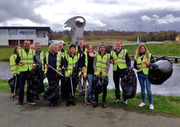 Pictured (left to right) are Fiona MacKinnon, Lewis Curdie, Kath Ferry (obscured), Matt Wedgwood, Susan Innes, Mark Forrester, Alanna Robertson, Andrew Davidson, Lynn Wilson, Emmanuelle Prefol, Mark McGrath, and Lucy Black