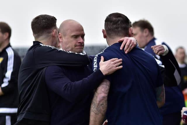 Brown Ferguson celebrates with his backroom team. Picture Duncan Brown