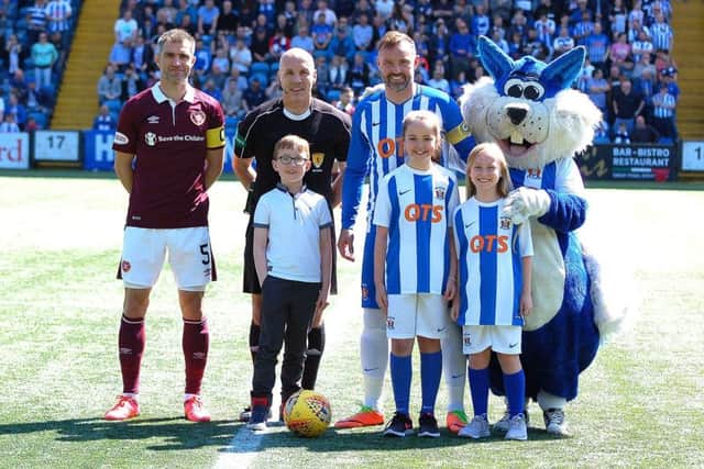His final match was Sunday involving Hearts and Kilmarnock where son Logan (7) joined him on the pitch. Picture courtesy Kilmarnock FC.