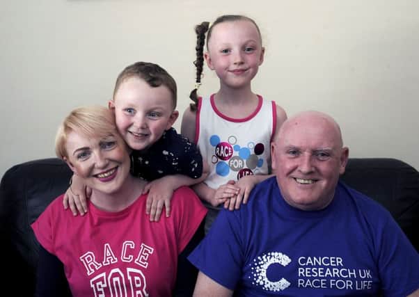 Family outing...Murray and Molly will join their papa Bernie Murray and mum Angela Stewart to start the Race For Life in Falkirk on Father's Day.  (Pic: Michael Gillen)