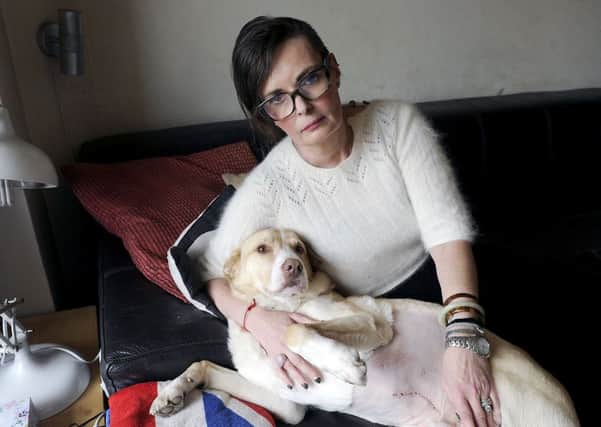 Mairi Summers says her dog Reilly is making a "slow recovery" following an operation to remove a discarded fishing hook swallowed by her pet in Callendar Park