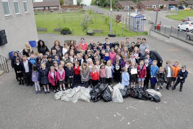 California Primary School. Litter pick involving parents, pupils and local residents.