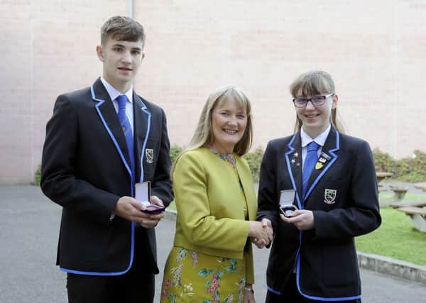 Jamie Scott (16), proxime accessit; Lesley Carroll, head teacher and Heather Richards (16), Dux.