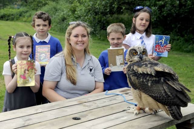 Bird keeper Callan Edwards introduces Denny Primary pupils (l-r) Abigail Carter, Arran Mackenzie, Samuel Johnson and Morven Thomson to a European Eagle Owl