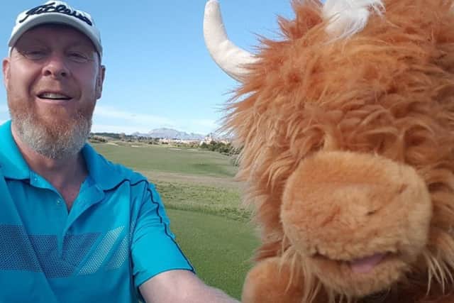 Andrew McGuirk, pictured with Hamish the Highland Cow, will undertake the challenge