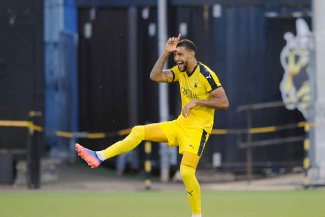 Dennon Lewis celebrates his first goal for the club