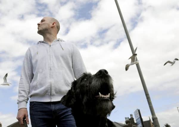 Colin Clarke says he and guide dog Vickie are regularly attacked by seagulls in Larbert. Picture: Michael Gillen