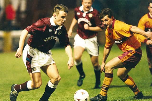 David Hagen (left) runs at John Philiben of Motherwell in a game at Fir Park in 1995. Picture: TSPL