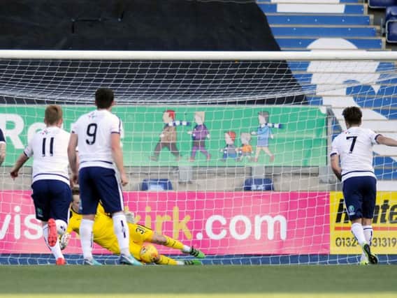 Robbie Mutch saves Jamie Bain's first half penalty