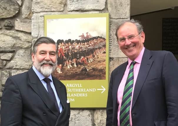 Lord Thurso (left) congratulates Colonel A K Miller on the museum project's lottery success.