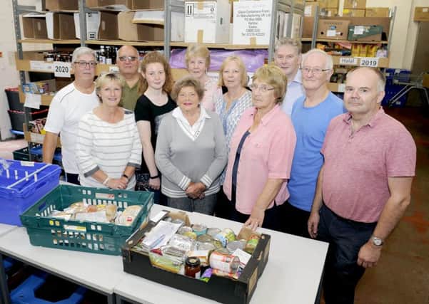Falkirk Foodbank chairman Alastair Blackstock with volunteers and manager Jim Couper.