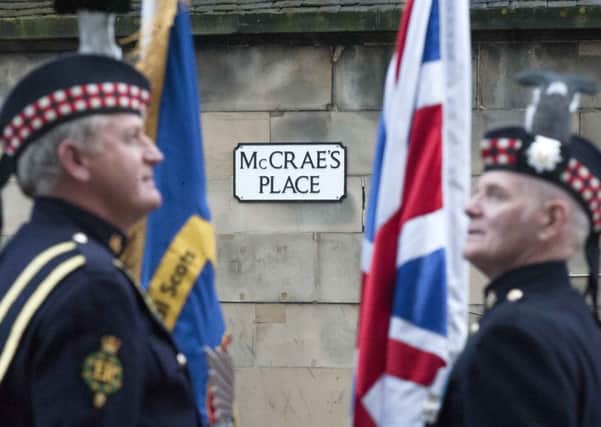 Pictured (left to right) are standard bearers Tom Logan and William Hoy, from the Royal Scots (Royal Regiment) Association at McCrae's Place in Edinburgh - named after the sports battalion in which several Bairns players were to serve.