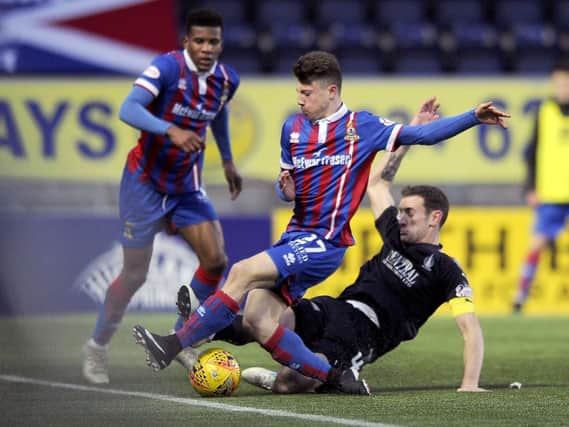 Aaron Muirhead gets stuck in against Inverness at The Falkirk Stadium last season.