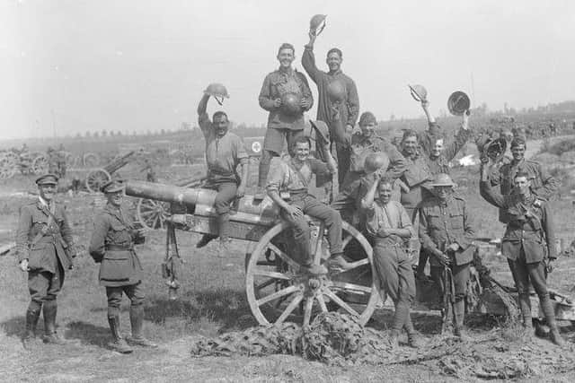 Following the capture of Grevillers by the New Zealand Division, Men of the Royal Garrison Artillery pose beside one of the 4.2 inch guns of a captured battery at Grevillers, 25 August 1918. Note the camouflage netting on the ground, which was designed to prevent the guns from being spotted from the air. © IWM (Q 11243)