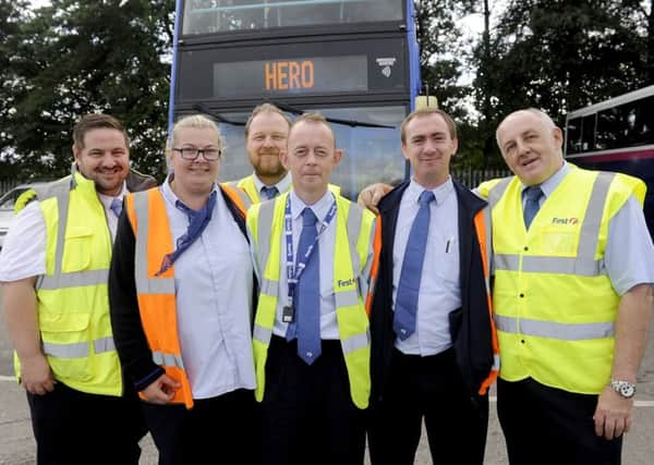 Driver Steven Dow (front, middle) was praised by First Bus management and colleagues for his speed of thought when a fire broke out on his bus. Picture: Michael Gillen