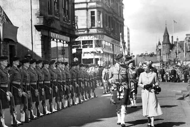 The Queen inspecting the guard of honour of the 7th Battalion Argyll and Sutherland Highlanders in her visit to Falkirk in 1955.
