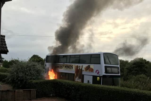 The vehicle caught fire in front of residents' homes. Photo credit: Graeme Bell