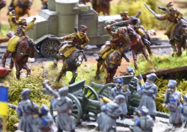 Wargaming covers a vast range of historical, fantasy and sci-fi subjects.  This scene features Boleshevik cavalry charging Ukrainian Nationalists in the Russian Civil War.