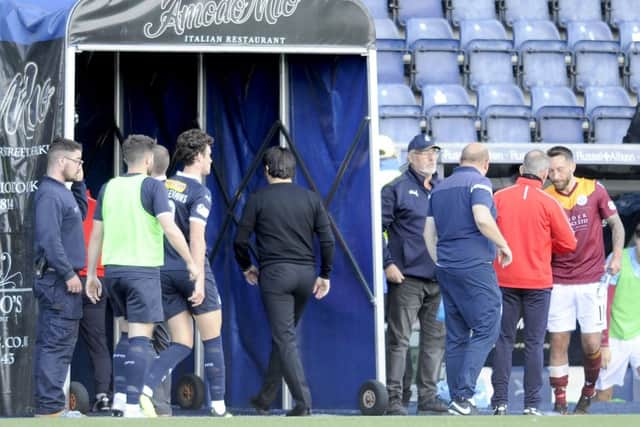 Paul Hartley heads down the tunnel at the end of a horrific afternoon on the pitch for the Bairns. Picture Michael Gillen.