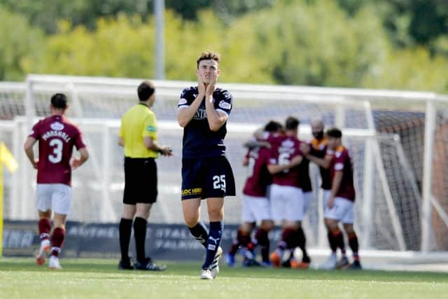 Andy Irving turns away after Dobbie's second. Picture Michael Gillen.