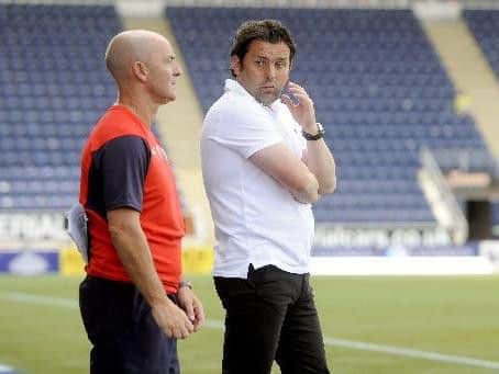 Gordon Young (left) will take over from Paul Hartley