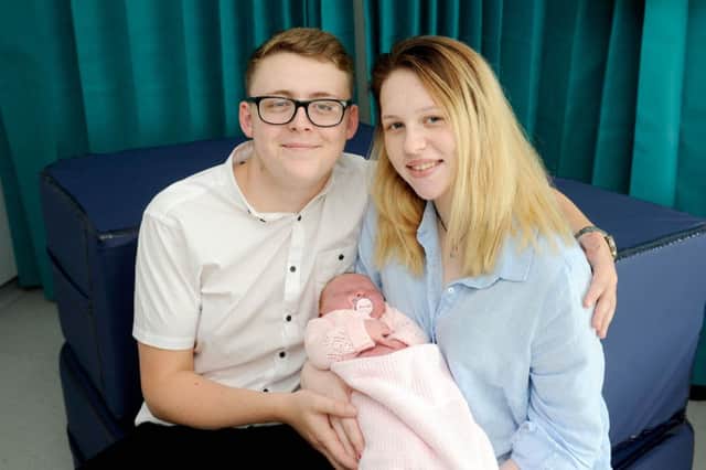 Megan Hawick (18) and Gary Fraser (19), with daughter Amelie Fraser, the first baby born at the new unit.