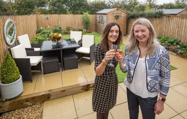 Sandy Casey of Walker Group (left) with Karen Weir winner of the housebuilders gardening competition