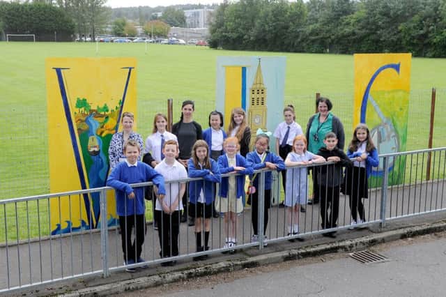Pictured: Moira McLaren, acting principal teacher; Mrs Istvanne Toth Hajnalka, parent and Michelle Paton teacher who ran the art club with the children who helped to transfer small original designs to large boards and paint the backgrounds
