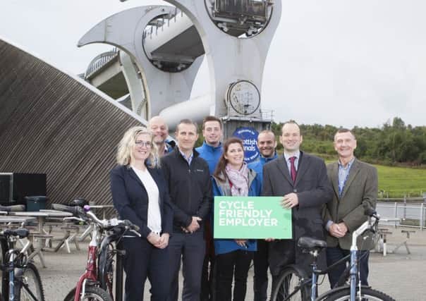 Pictured are, from left to right: Katharine Brough, Michael Matheson MSP (cabinet secretary), Catherine Topley and Keith Irving, with Scottish Canals staff at the Falkirk Wheel.