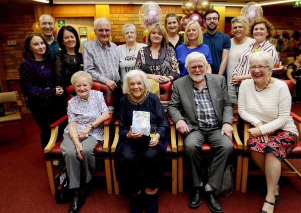 Elizabeth Fraser (front, second from left) was joined by her son Ron (front, middle), his wife Hilary (front, far right) and several other friends and family members on her 100th birthday. Picture: Michael Gillen