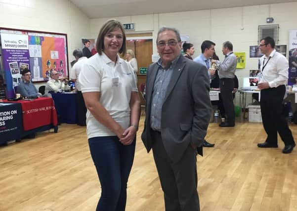 Making connections...Claire Bernard, partnership manager at CVS Falkirk, with Falkirk MP John McNally at last year's Older People's Day in Denny.