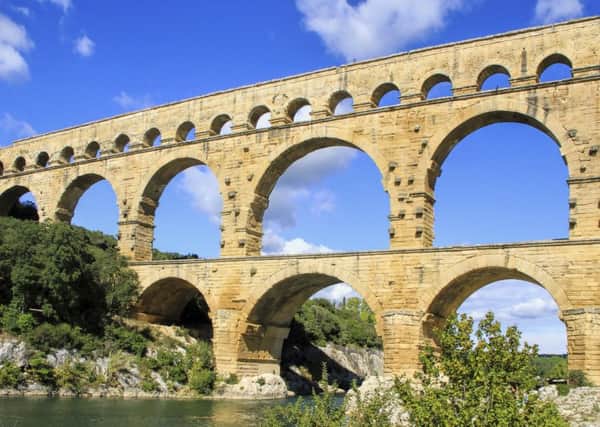 A famous Roman aqueduct in what is now France.  It took a long time to build because the Romans, while ingenious, did not have Lego.