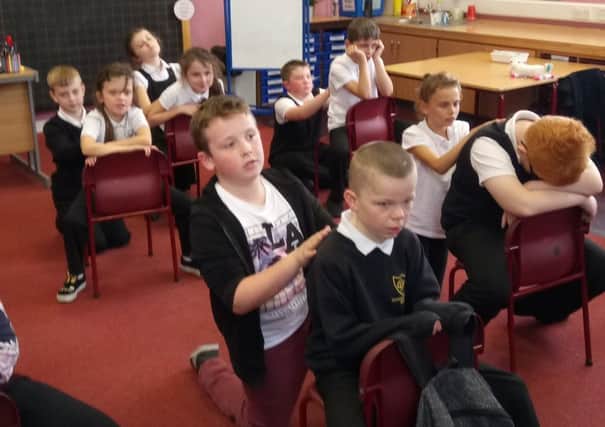 Carmuirs Primary School pupils take part in a Massage in Schools Programme session