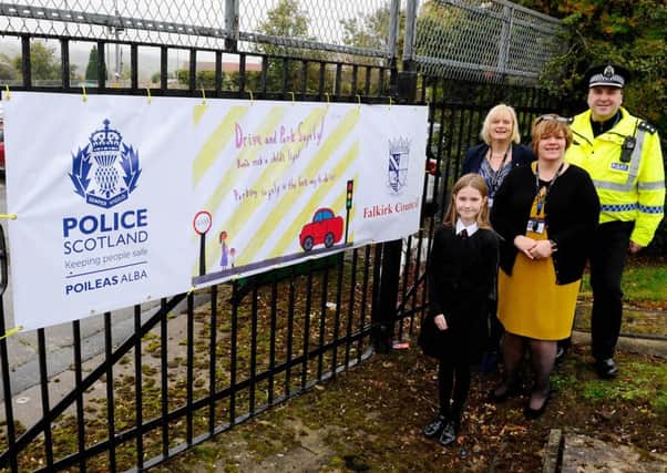 Hallglen Primary pupil Phoebe Dollar is pictured with headteacher Alison McCalley, Chief Inspector Damian Armstrong and council leader Cecil Meiklejohn. Picture: Michael Gillen