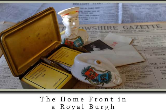The book cover of Linlithgow in the Great War: The Home Front in a Royal Burgh with items from Alan Dowells personal artefacts collection.