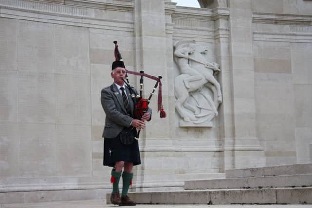 Charles playing the pipes at Arras - an experience he  will never forget.