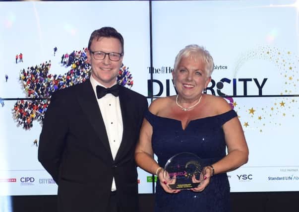 NHS Forth Valley's Lynn Waddell is presented with the Lifetime Achievement Awardt by Neil Kennedy, managing partner of MacRoberts LLP at the Herald and GenAnalytics Diversity Awards at the Radisson Blu hotel on October 11, 2018 in Glasgow.