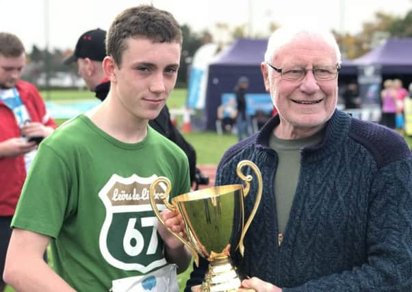 Adam Canavan and dad Dennis at the end of the Strathcarron 10k - Adam won the Paul Canavan Cup which was named in honour of his brother, who died at Strathcarron Hospice aged just 16