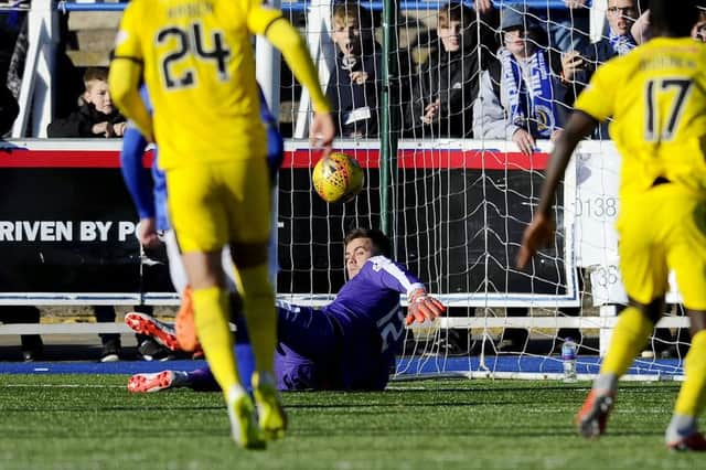 David Mitchell prepares to pounce on Stephen Dobbie's penalty after pushing it onto the post. Picture Michael Gillen.