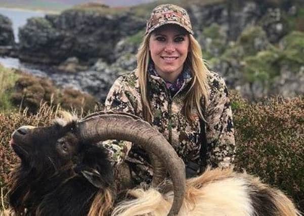 Goat hunter Larysa Switlyk, pictured with one of the animals she killed.