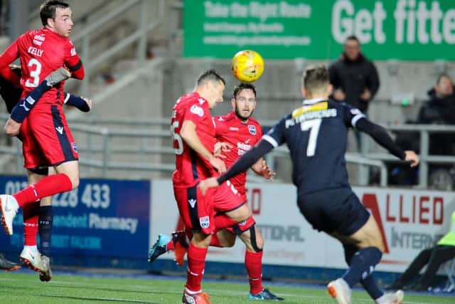 RObson's cross catches the unfortunate DOn Cowie for Falkirk's opener. Picture Michael Gillen.