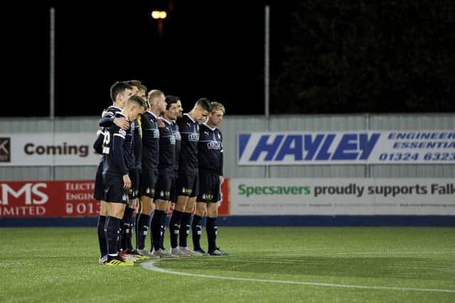 Falkirk have showed togetherness this week in the match, and also came together before kick-off for a mark of respect for the victims of the Leicester helicopter crash. Picture Michael Gillen