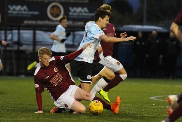 Alan Cook saw red for this tackle. Picture Alan Murray