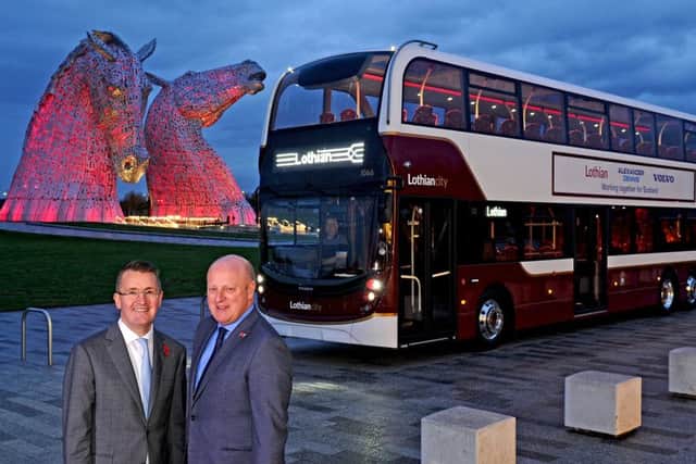 Colin Robertson (left), ADL chief executive, presented the first of the 42 double decker buses the firm will build for Lothian Buses to its managing director Richard Hall. Pictures: Michael Gillen