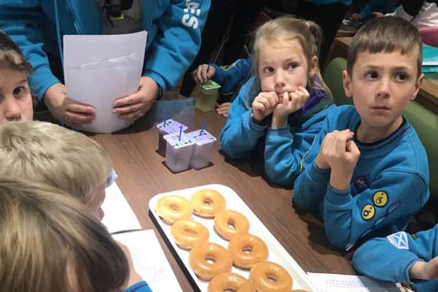Cubs enjoying their doughnuts courtesy of Krispy Kreme
