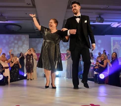 Anne Riley took to the catwalk to help Breast Cancer Care
